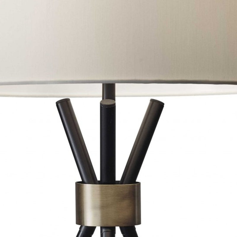 Black Metal Tripod Leg With Antique Brass Accent Table Lamp